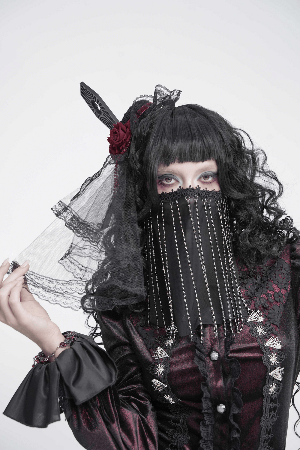 Black Gothic Face Veil Mask with Beaded Fringe worn by a model, showcasing intricate details and stylish design.