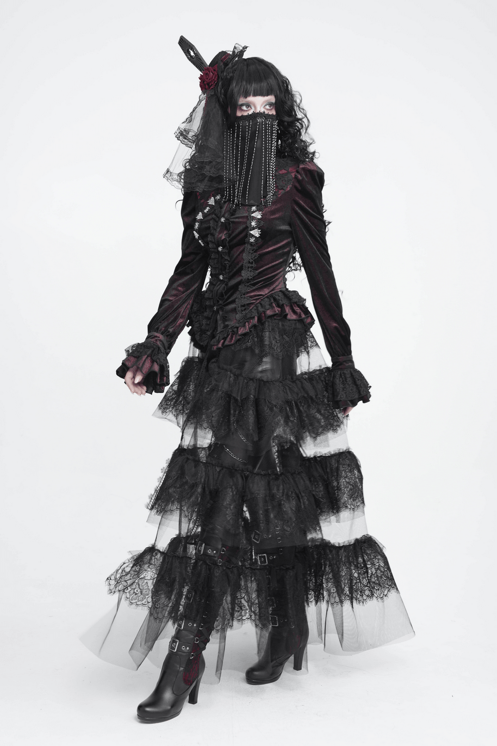 Black Gothic Face Veil Mask with Beaded Fringe worn with a dramatic gothic outfit featuring layers of lace and ruffles.