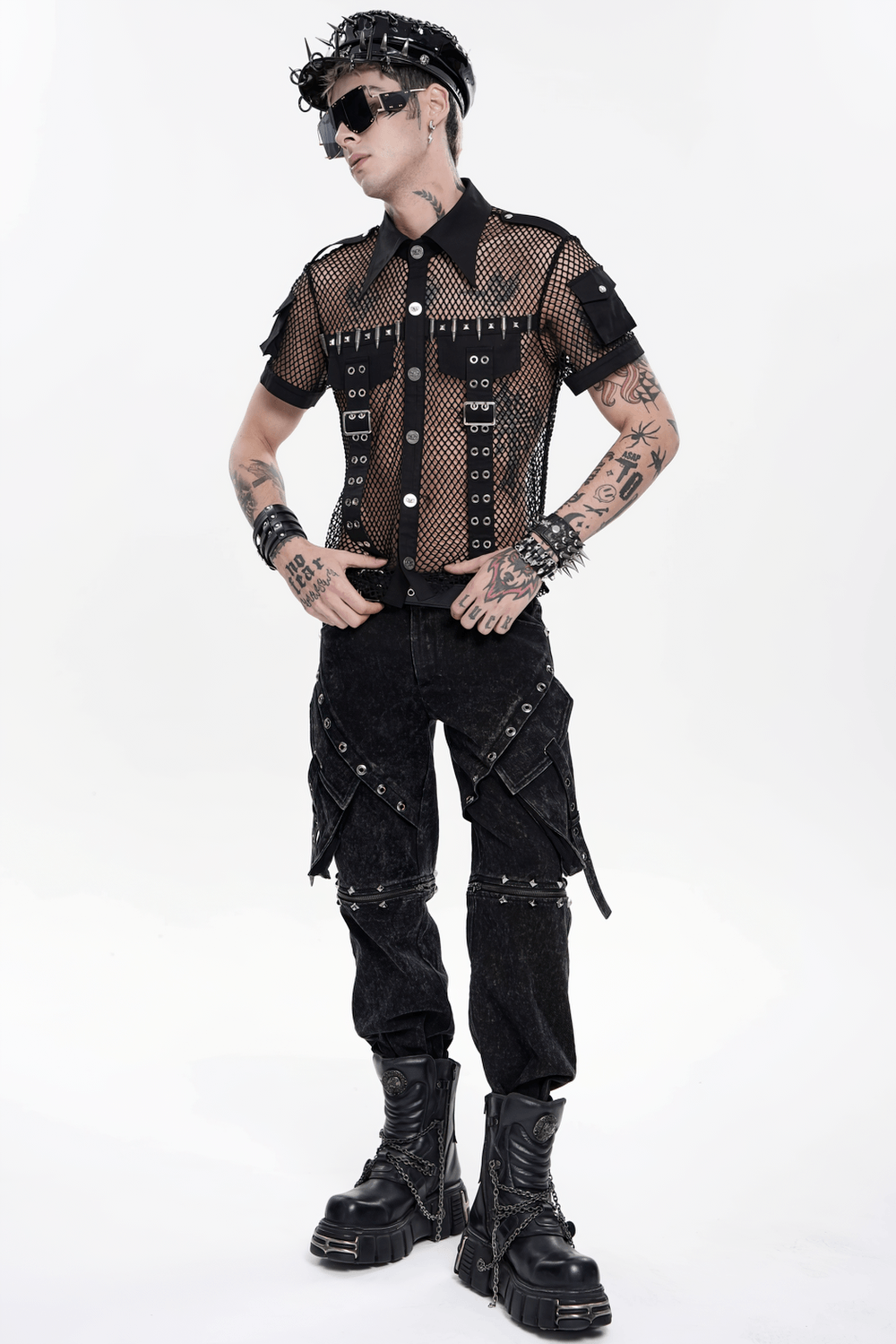 Black Punk Zip-Off Pants with Studded Grommets worn by a model in a punk outfit, featuring a mesh shirt and industrial accessories.