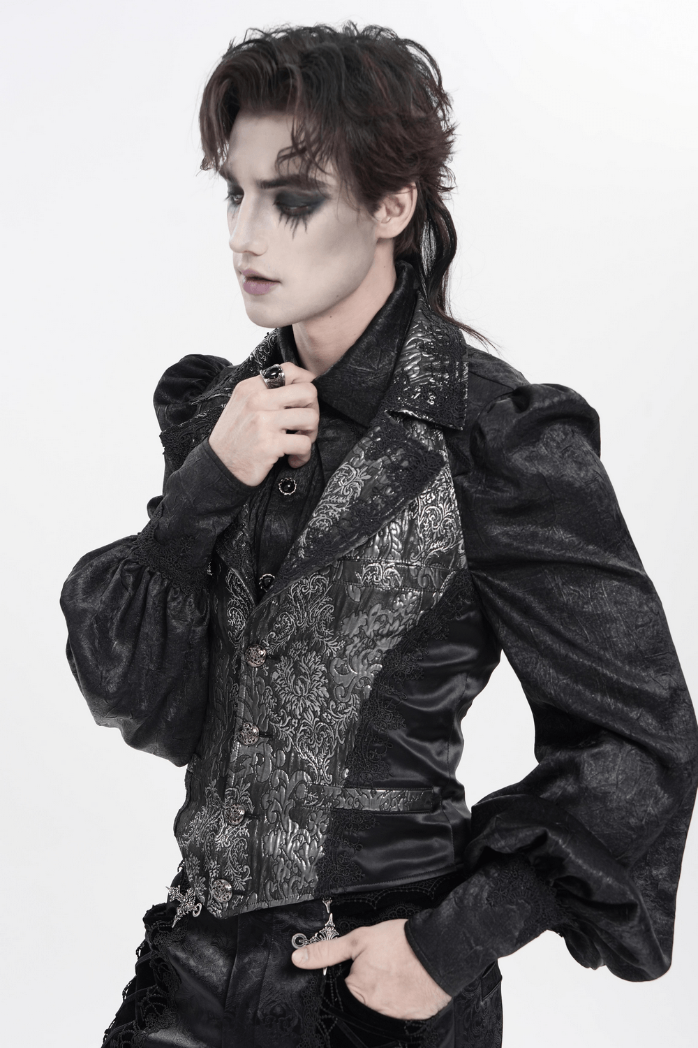 Black Silver Gothic Brocade Waistcoat with Lace modeled by a person with dramatic makeup and unique hairstyle.