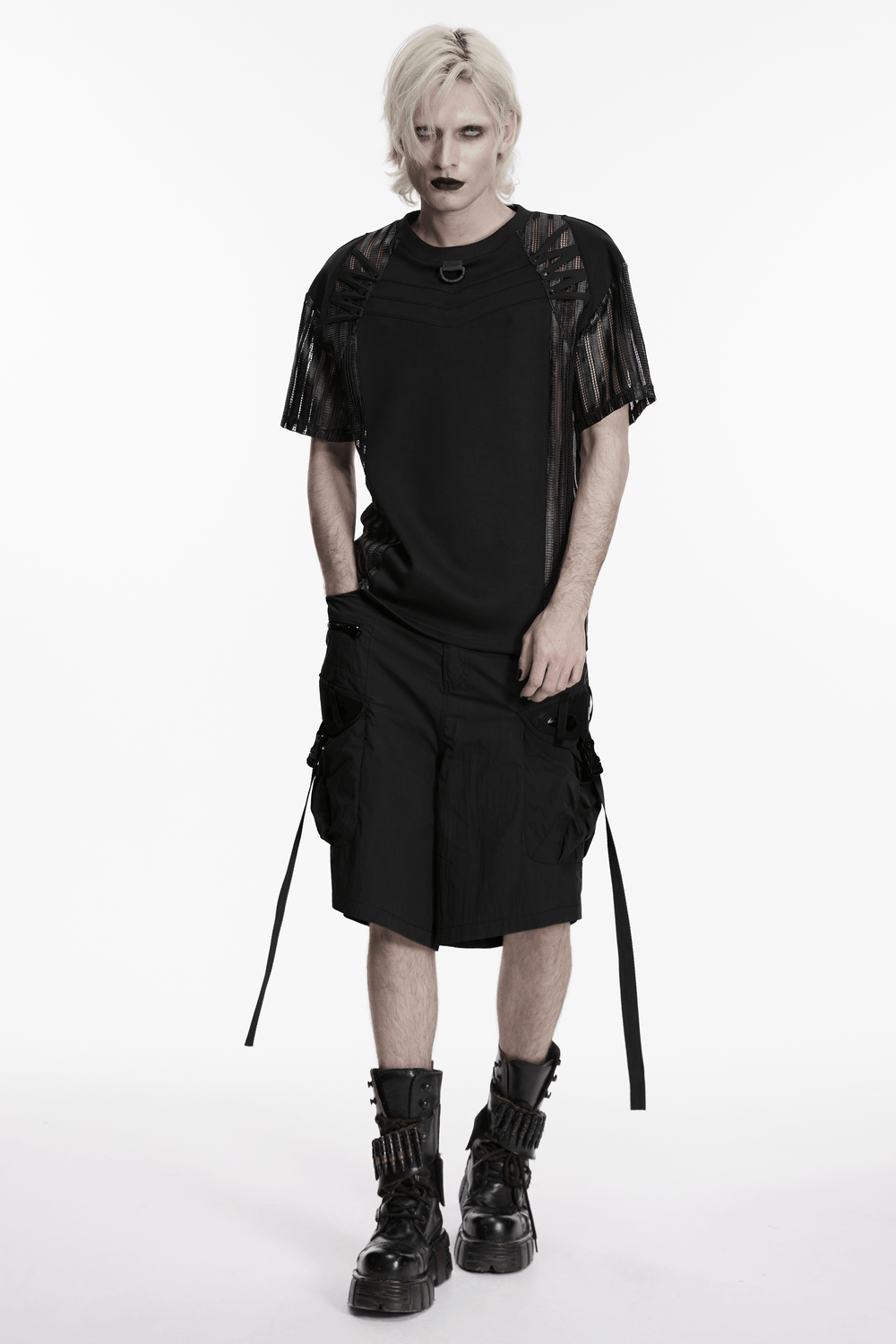 Black Techwear Cargo Shorts With Hanging Straps worn with a stylish edgy black top and bold accessories.