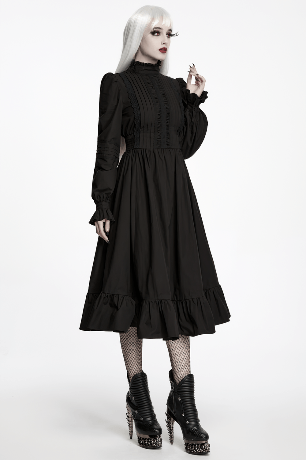 Black Victorian Gothic Midi Dress with Ruffle Hem modeled by a model in a dramatic pose, showcasing its elegant design.