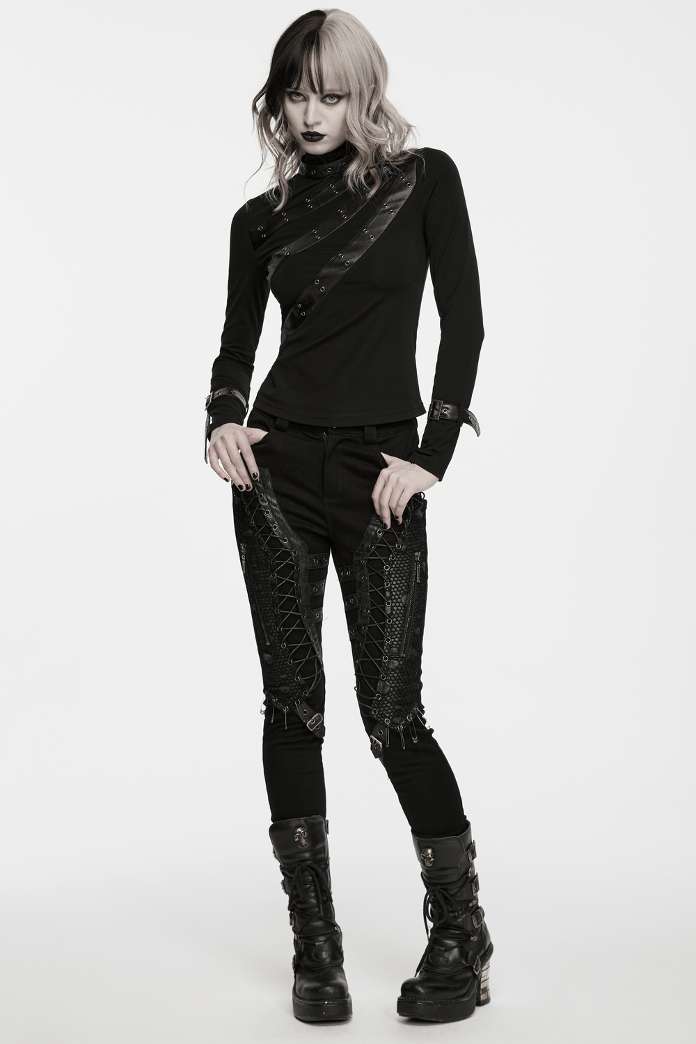 Bold Gothic Lace-Up Skinny Jeans with Buckle Details worn with a stylish top and bold makeup.