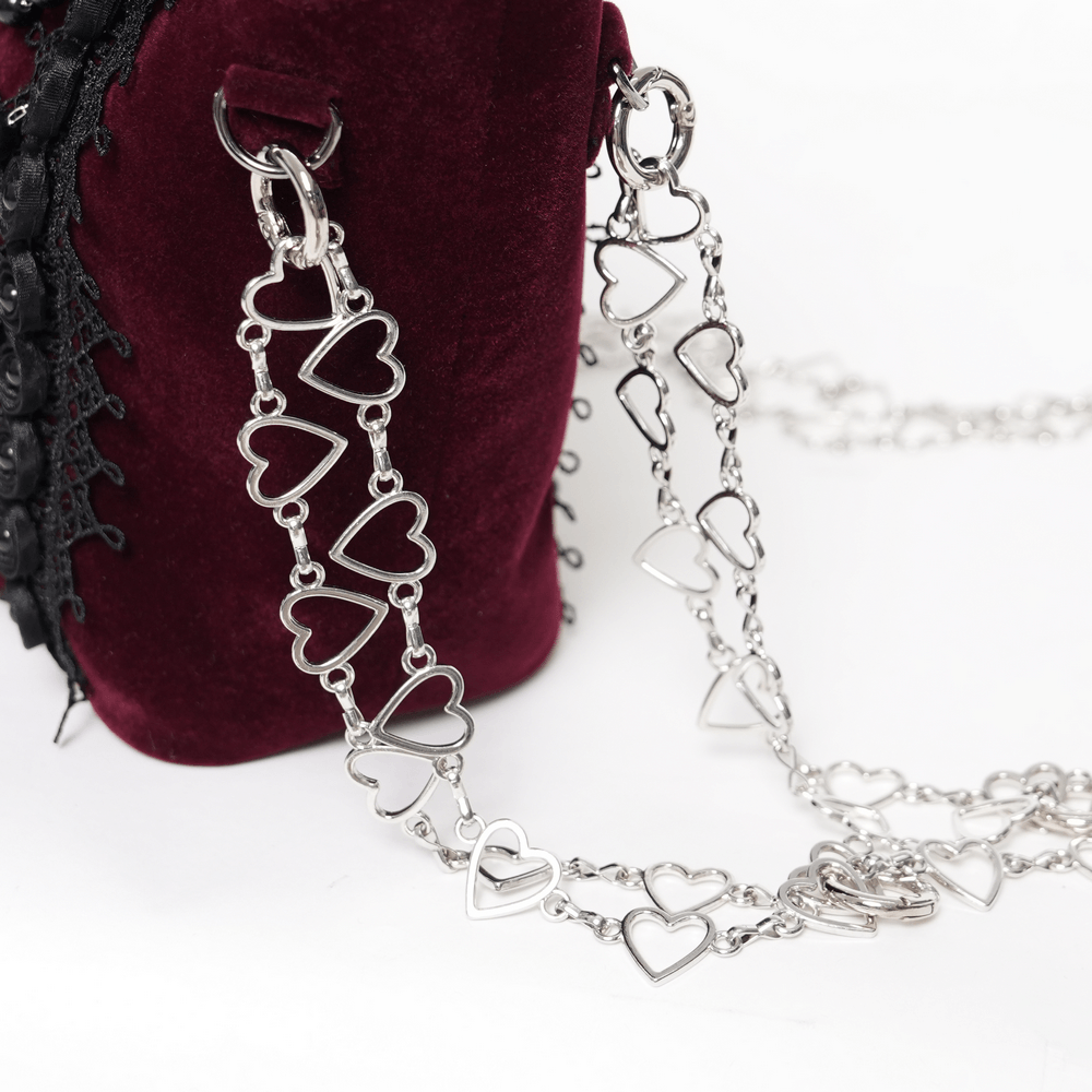 Alt Tag: Burgundy Gothic Rose Handbag with Lace and Chains in burgundy velvet with black lace and silver heart chain strap close-up