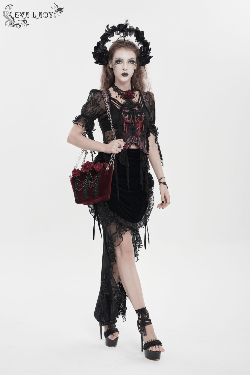 Burgundy Gothic Rose Handbag with Lace and Chains carried with black lace gothic dress, silver heart chain straps, velvet rose applique