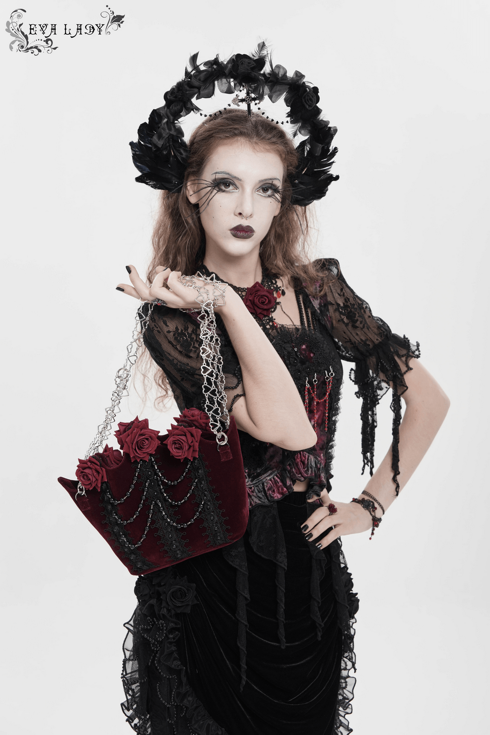 Alt Tag: Burgundy Gothic Rose Handbag with Lace and Chains in burgundy velvet with rose appliques, black lace panels, bead drapes, silver heart chain straps