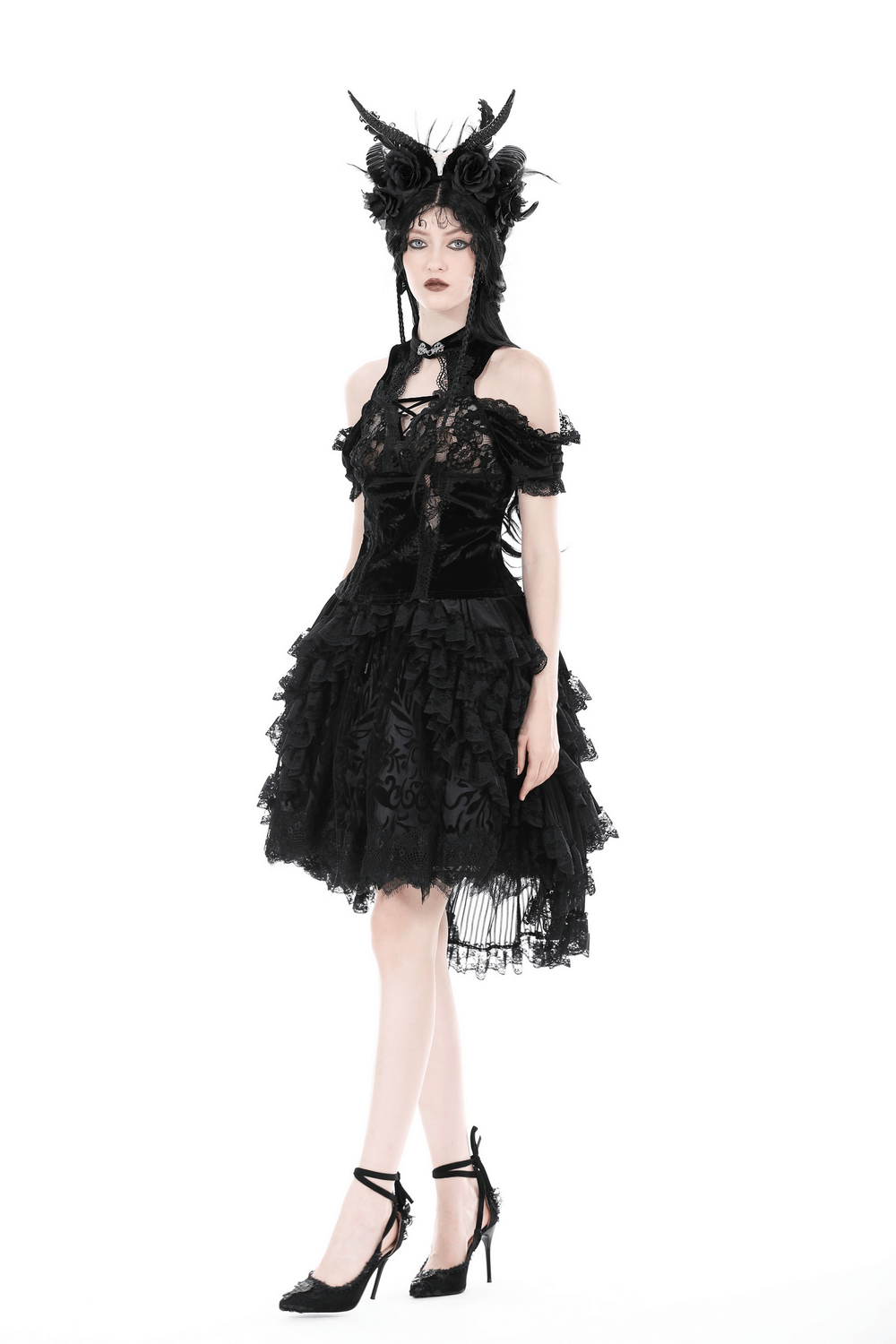 Elegant black lace off-the-shoulder dress with intricate patterns and a stylish modern twist.