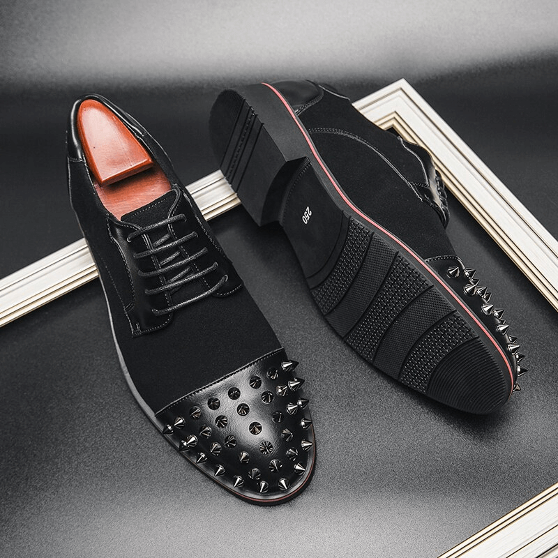 Men's lace-up dress shoes with spikes, perfect for alternative fashion and bold statements.