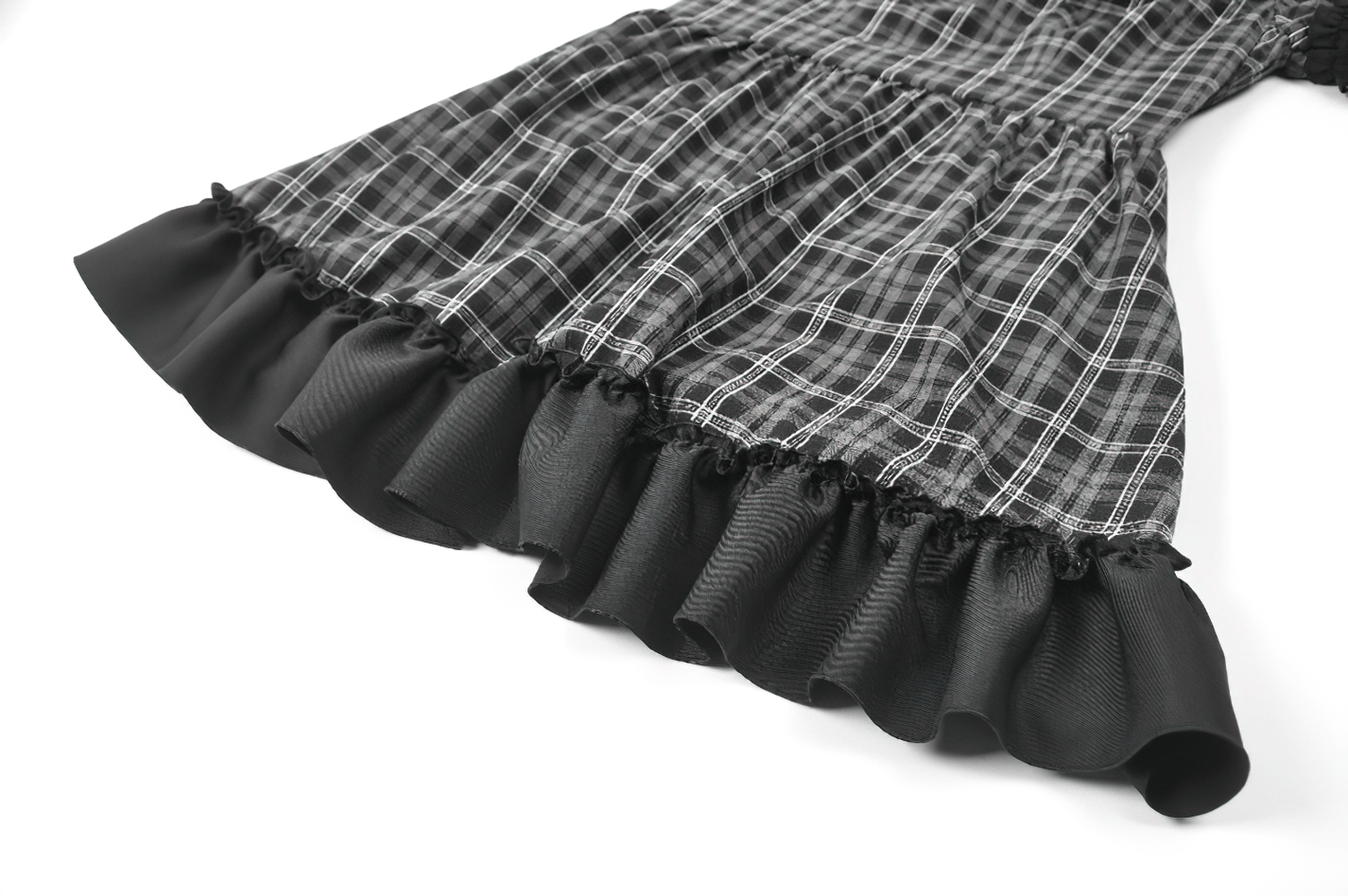 Female Plaid Lolita Dress with Lace Ruffle Trim and Bow close-up showing fabric and ruffle details.