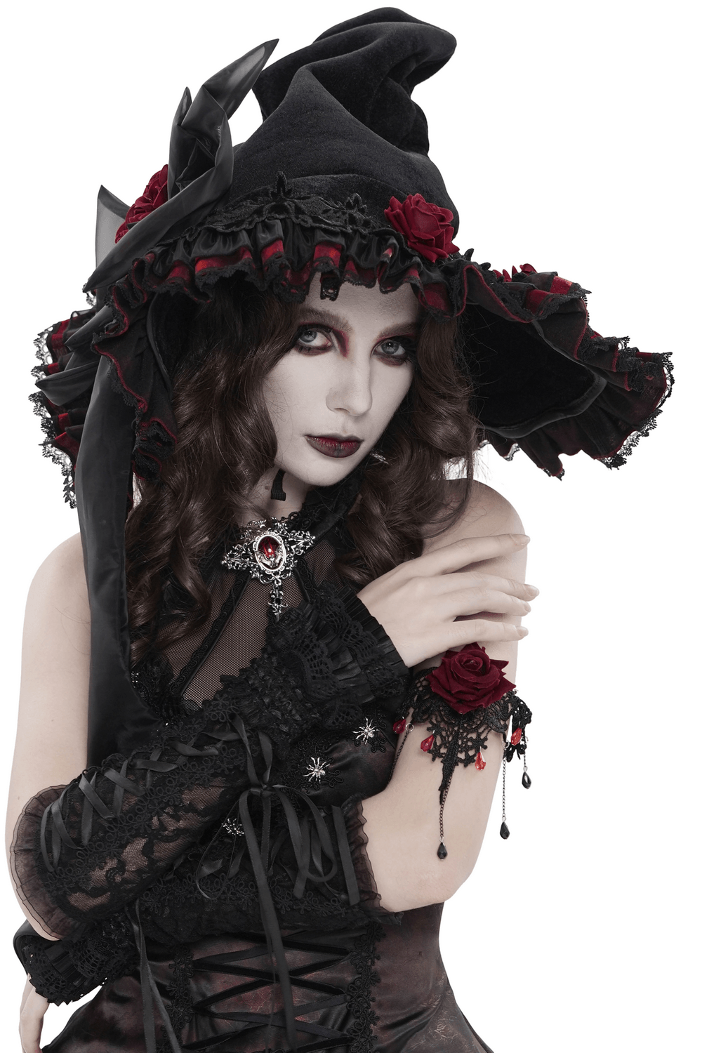 Goth Witch Hat with Roses and Sheer Ribbon Trim for Women worn by model with dark makeup and gothic attire.