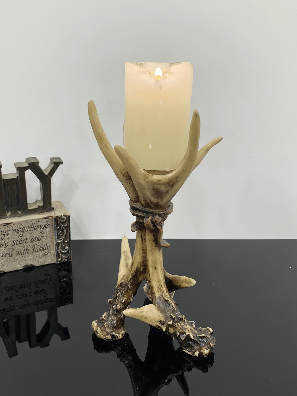 Gothic Antler Candle Holder with Rustic Bone Finish featuring a pillar candle on a rustic antler design.