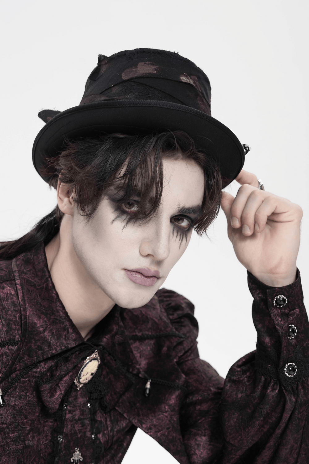 Gothic Distressed Top Hat With Vintage Lace Trim worn by a model dressed in dark Victorian fashion.