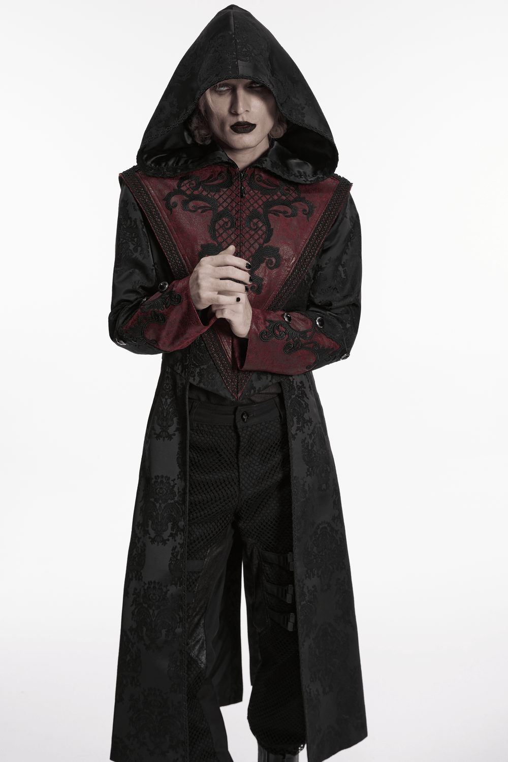 Gothic Hooded Jacquard Long Coat with Leather Trim worn by a model, featuring ornate embroidery and a dramatic hood.