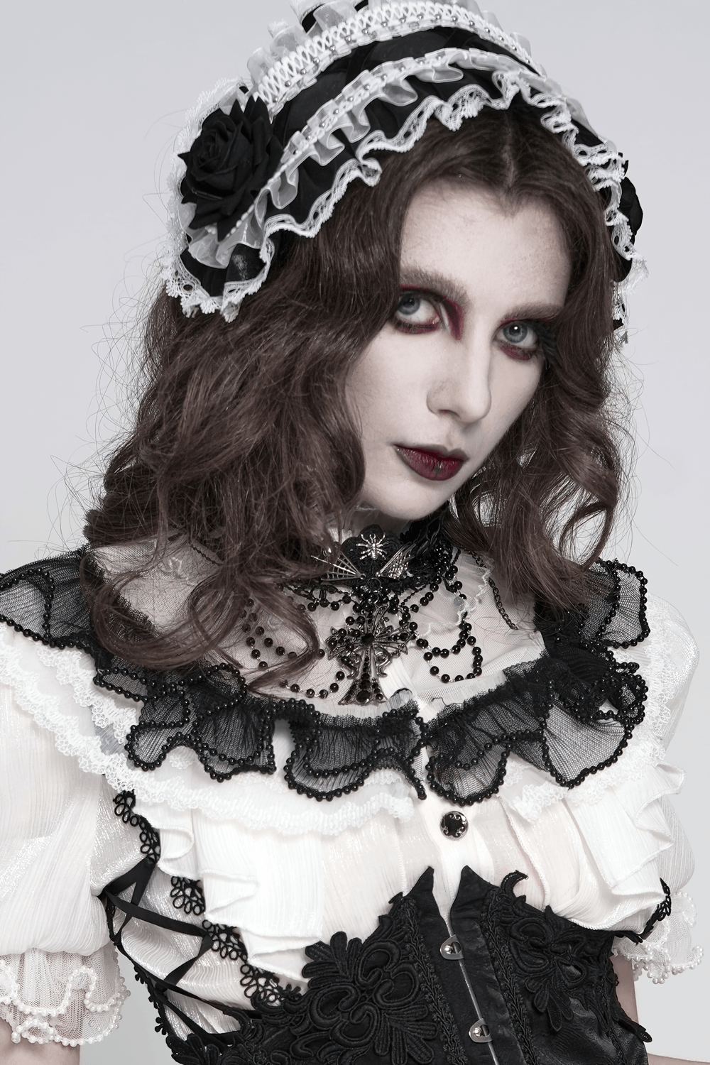 Gothic Lace Choker Necklace with Cross Pendant worn by model in Victorian-inspired outfit with lace details.