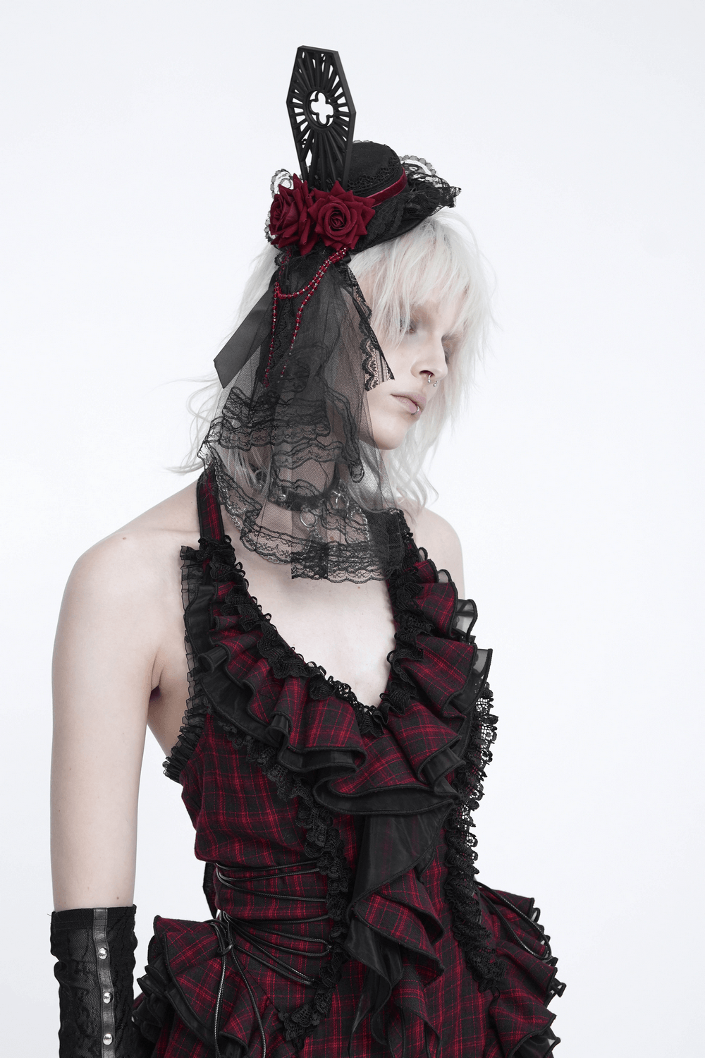 Gothic Mini Top Hat Fascinator with Lace Veil and Roses worn by model in red plaid outfit, showcasing dark romantic style.