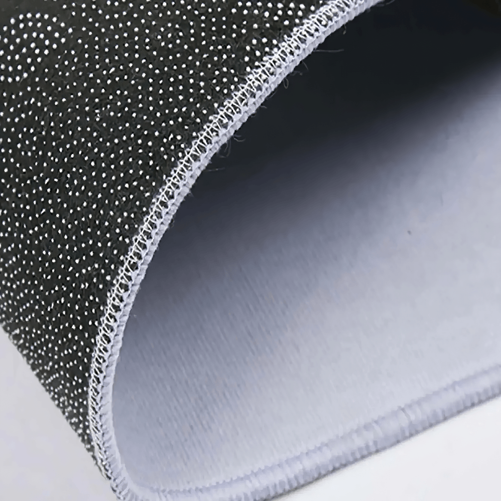 Close-up of the soft edge of the Gothic Moon Round Rug for Bohemian Living Rooms showcasing its black velvet texture.