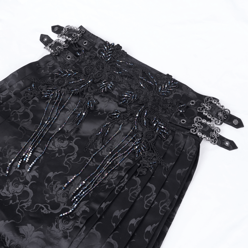 Gothic black skirt featuring intricate embroidered embellishments and dramatic silver details.