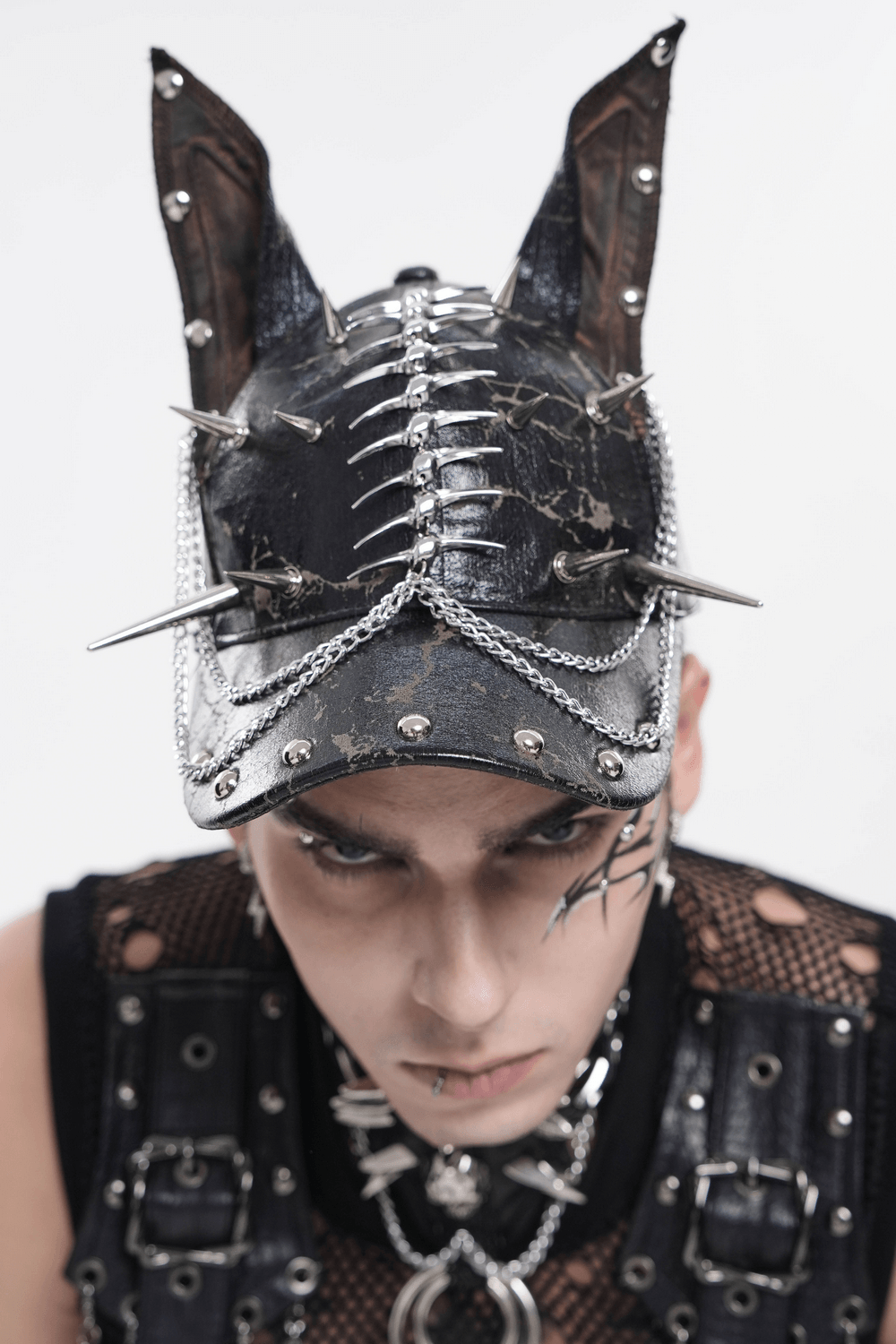 Gothic Spiked Cat Ear Cap With Studded Chains worn by a model showcasing a punk style.
