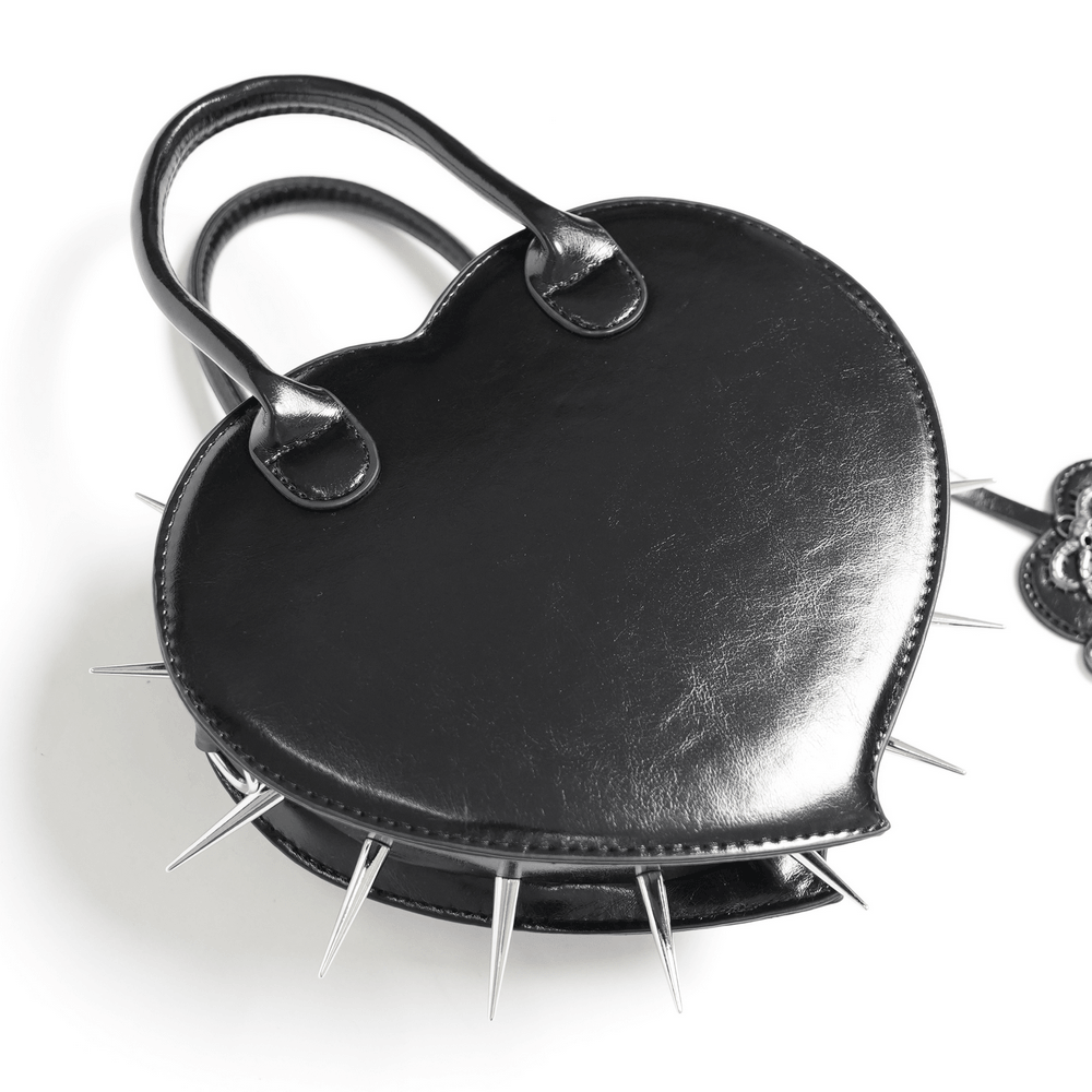 Gothic Spiked Heart Handbag with Pentagram Charm featuring metal spikes and sleek black synthetic leather.