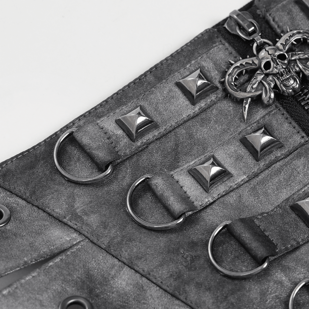 Gothic Studded Corset Belt With Front Zipper Detail showcasing pyramid studs and skull charm.