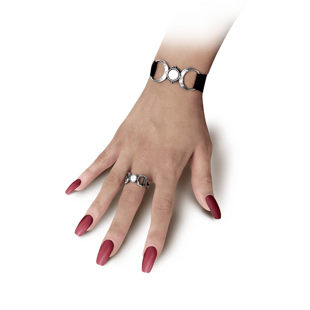 Gothic Triple Goddess choker and ring set with moon details on a hand with long red nails.