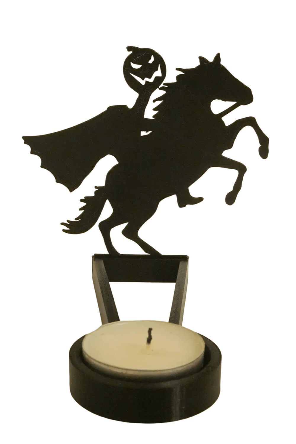 Halloween Shadow Tealight Holder with Metal Scene featuring a spooky horseman silhouette casting eerie shadows.