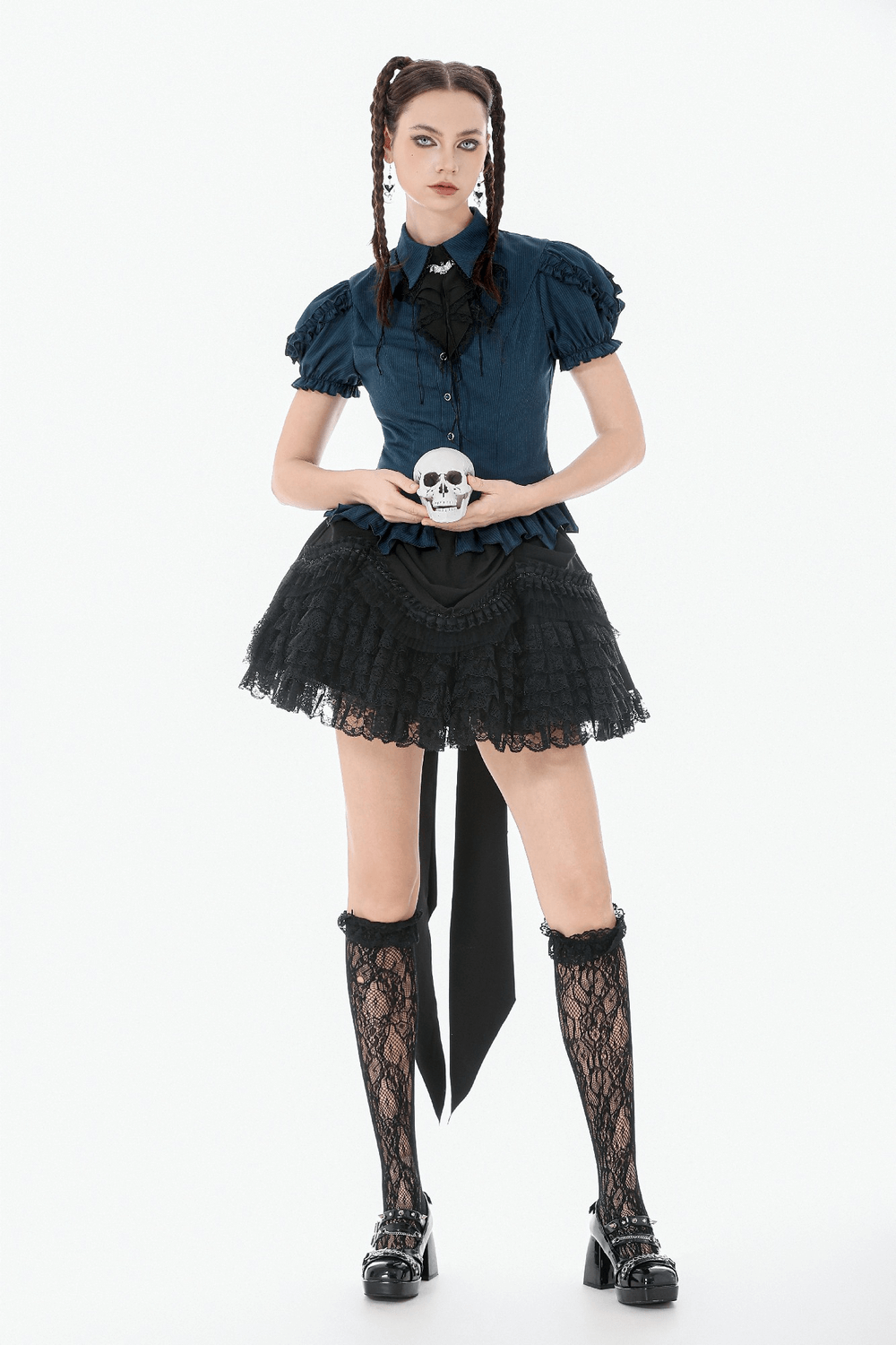 Lace Layered Black Tulle Skirt with Ribbon Detail styled with skull prop, perfect for gothic or punk fashion.