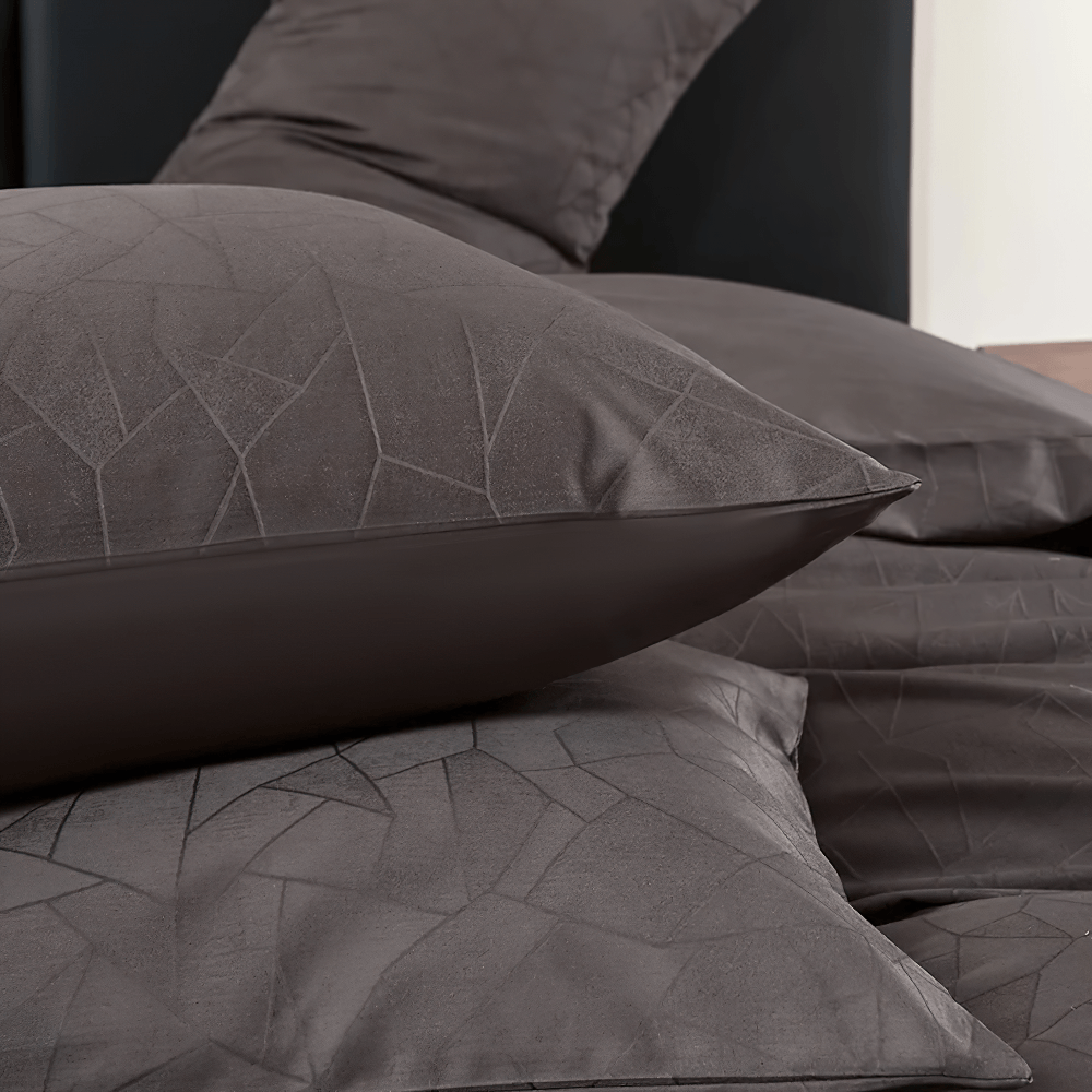 Long Staple Cotton Sateen Jacquard Bedding Set featuring luxurious pillows and a smooth geometric pattern.
