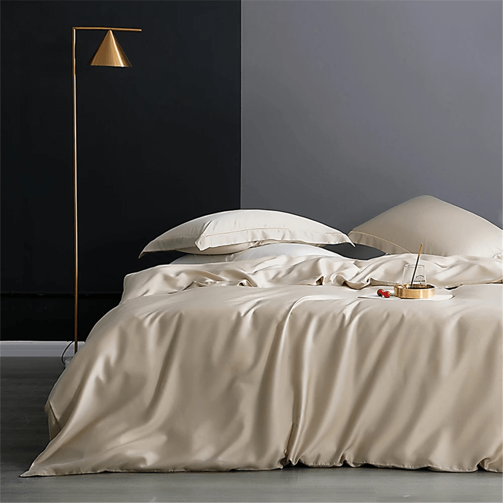 Nature Silk Bedding Set with Duvet Cover and Sheets in elegant beige color on a stylish bed with modern decor.