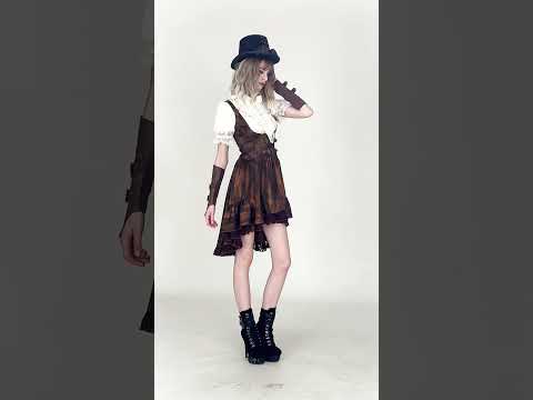 Brown Steampunk Buckle Dress with High-Low Lace Hem modeled with layered accessories and platform boots.