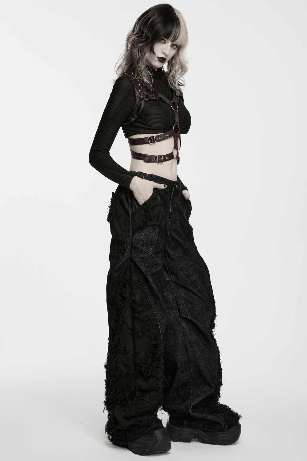 Punk Wide Leg Corduroy Pants with Shredded Mesh worn by a model with a stylish edgy look.