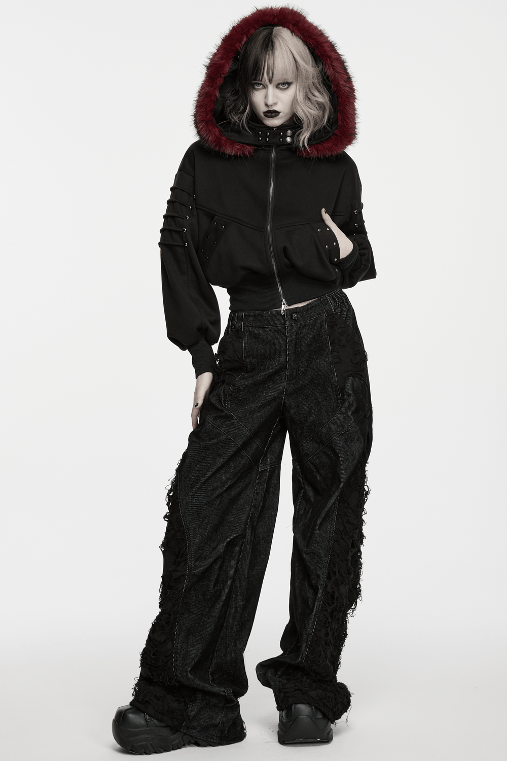 Model showcasing Punk Wide Leg Corduroy Pants with Shredded Mesh and stylish hoodie, highlighting bold punk fashion.
