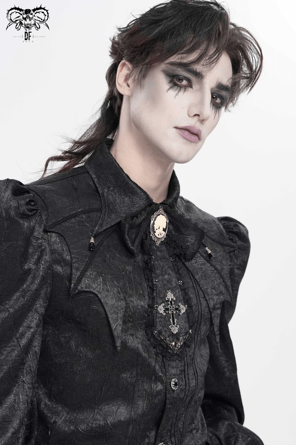 A model showcasing the Victorian Bow Collar Neckpiece with Baroque Lace Drop Tie, featuring gothic styling and a cameo cross pendant.