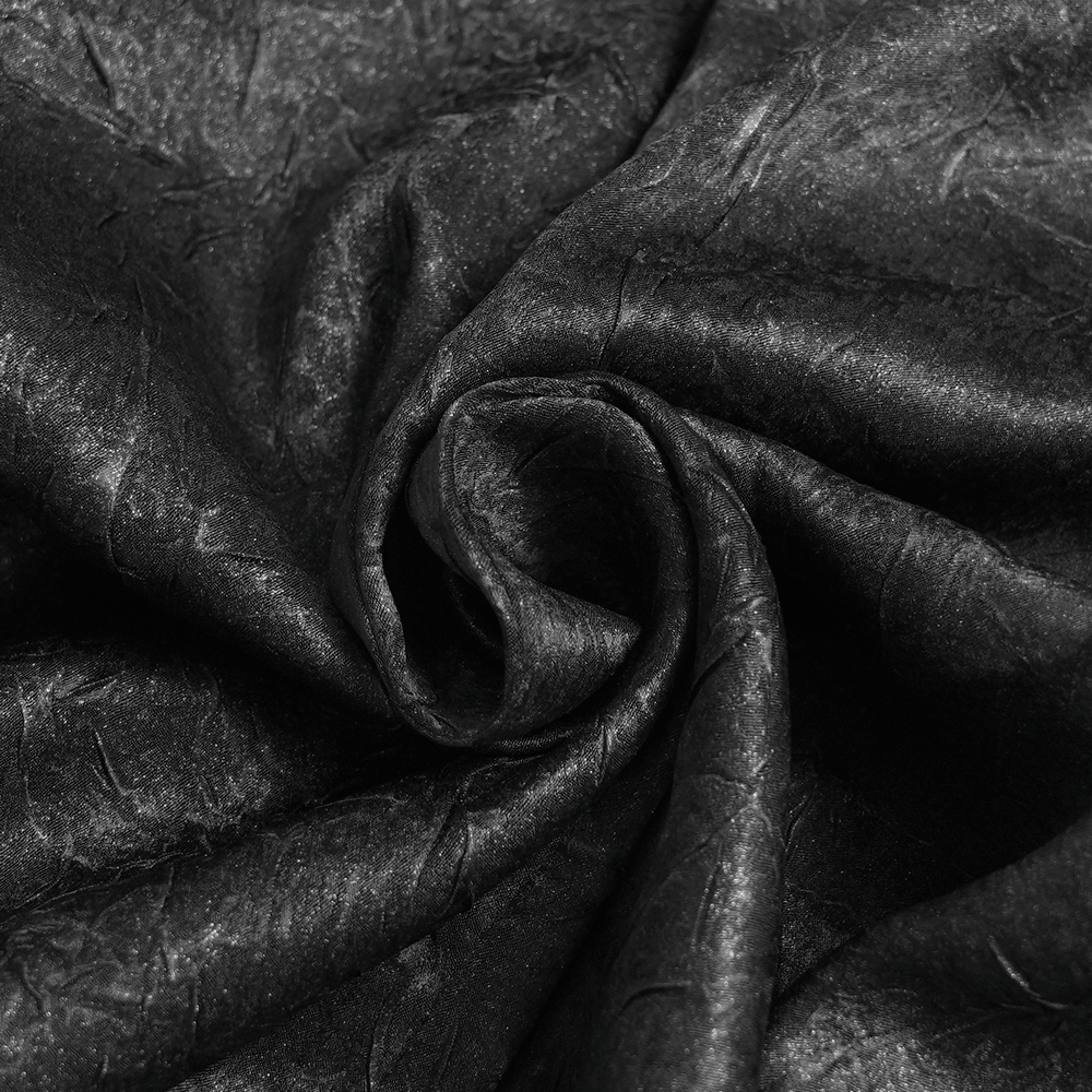 Victorian Goth Button Shirt With Cameo and Cross Brooch fabric close-up, showcasing textured black material.
