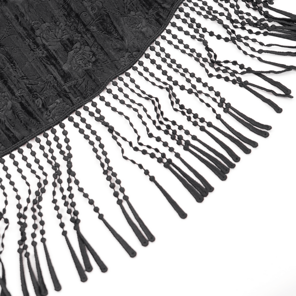 Close-up of black lace fabric with tassel details, perfect for a Victorian high-waist skirt.