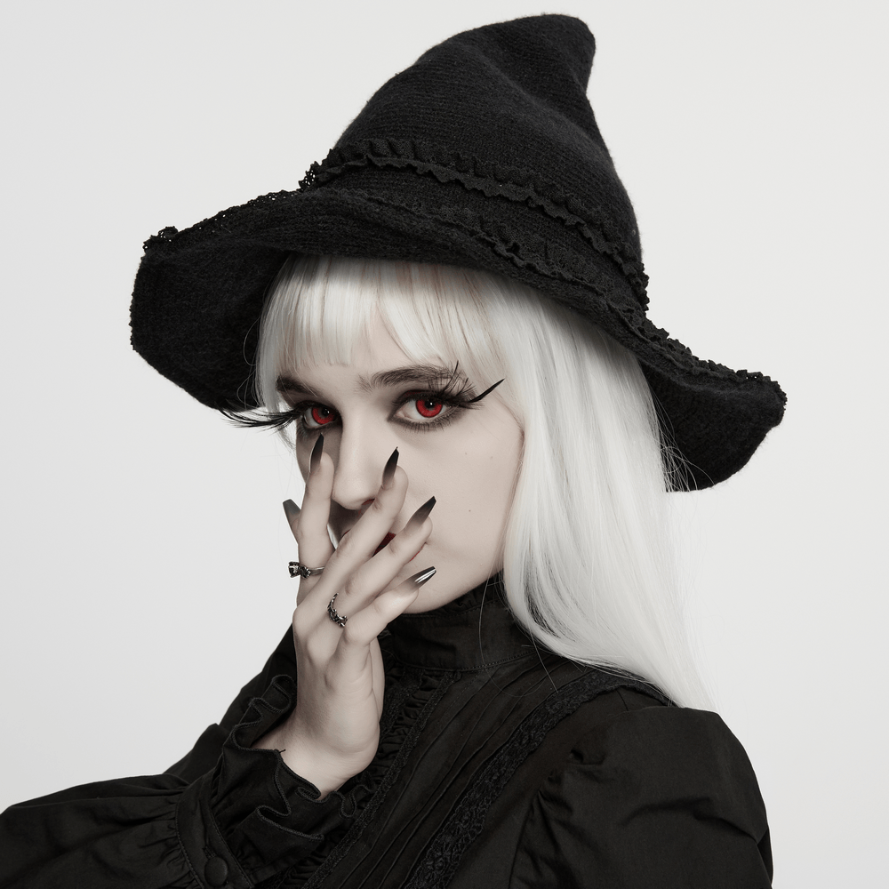 Vintage Black Gothic Pointed Witch Hat with Lace Trim worn by a model with striking red eyes and gothic style.