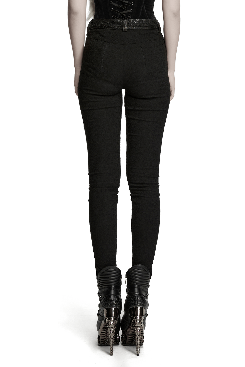 Women's Gothic Jacquard Slim Fit Tapered Pants showcasing a fitted silhouette with lace waist detail and edgy high-heeled boots.