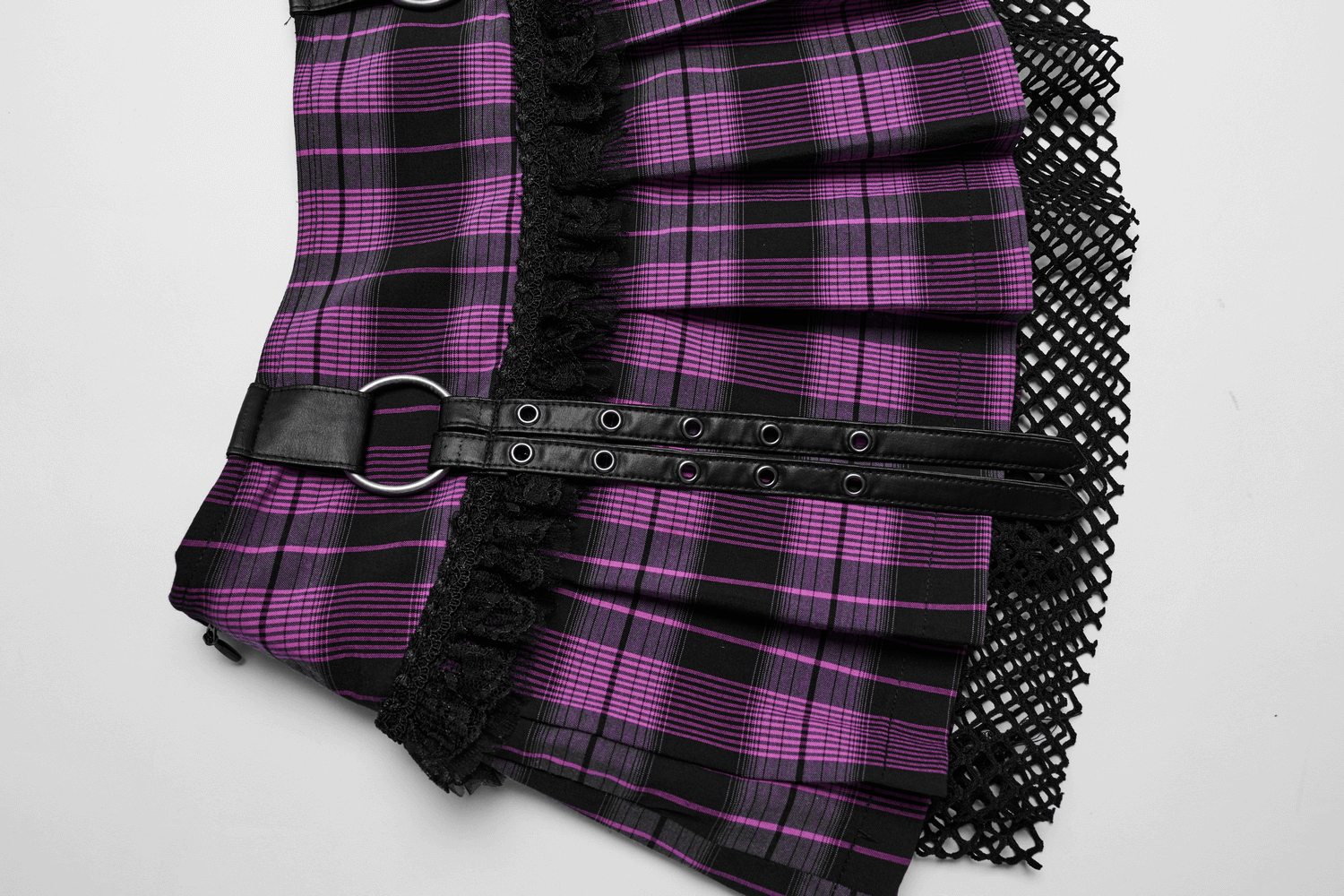 Women's purple plaid grunge mini skirt with lace trim and mesh overlay, showcasing punk rock details for edgy style.