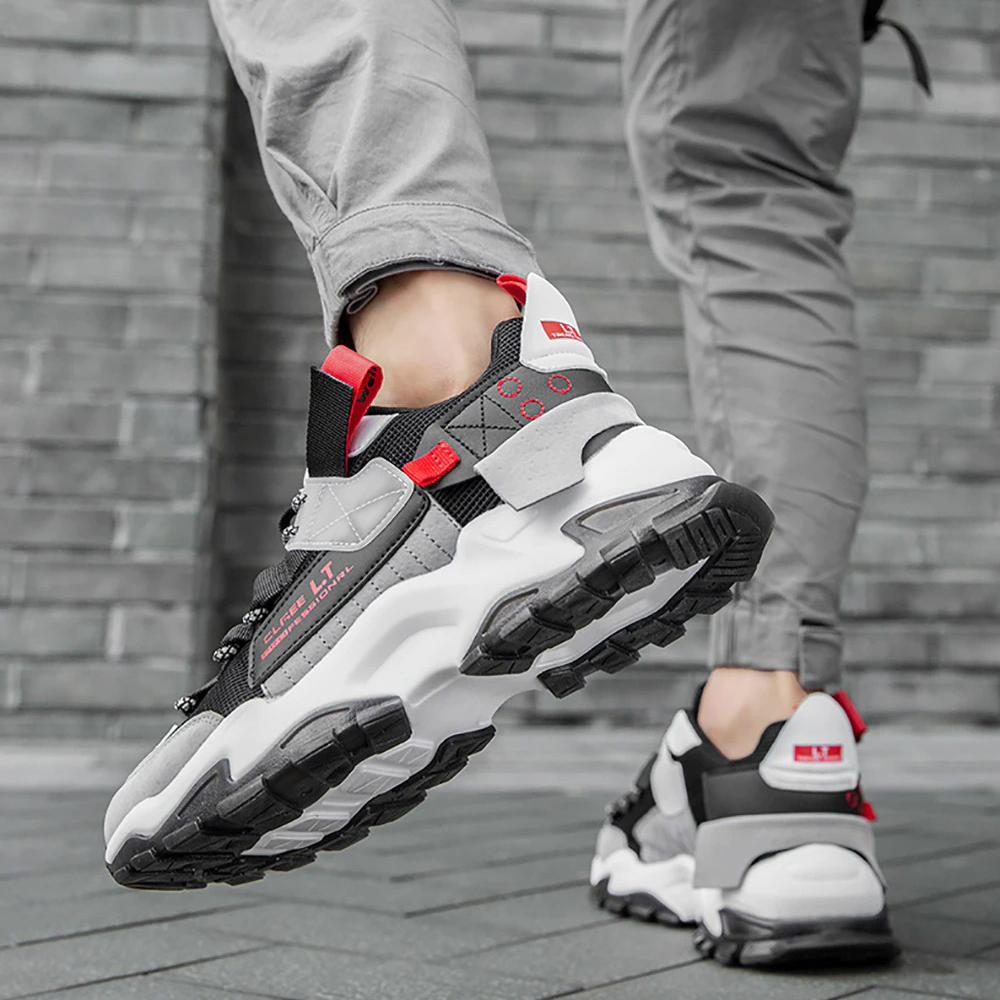 Men's breathable sneakers in gray and red, perfect for casual wear and running, showcasing a flexible sole design.