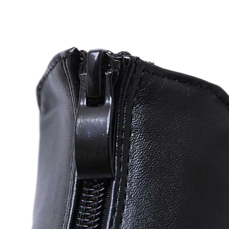 Close-up of a black zipper detail on women’s open toe fashion platform sandals.