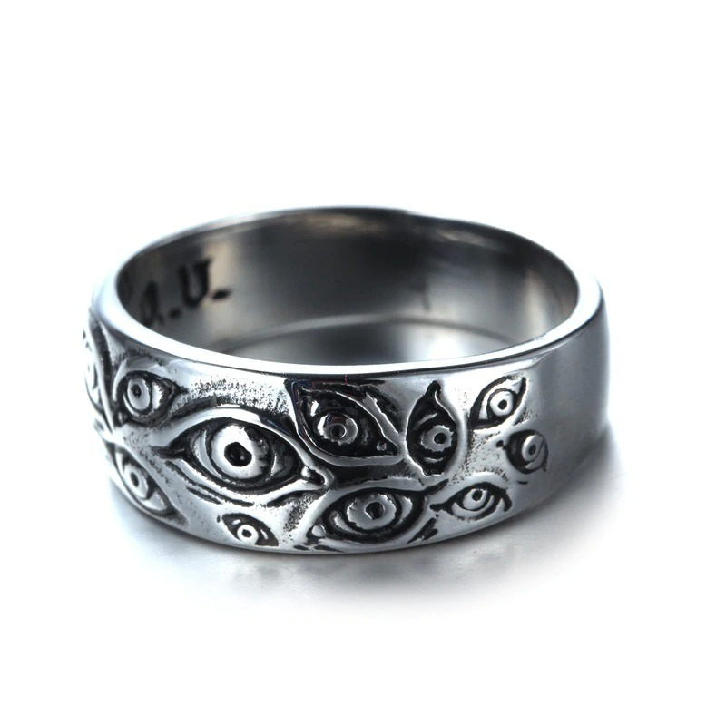 Vintage punk ring with carved eyes, unisex zinc alloy design perfect for alternative style outfits.