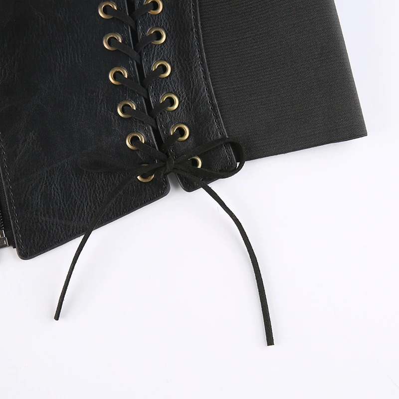 Close-up of black vintage women's lace-up and zipper corset belt showcasing lace details and PU leather texture.