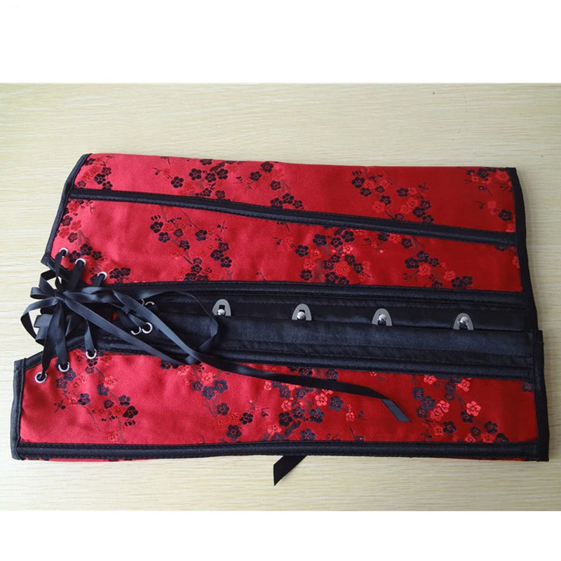 Elegant red gothic lace-up corset with floral print, showcasing stunning details and design.